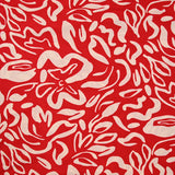 Jersey de polyester imprimé formes de fleurs écru fond rouge