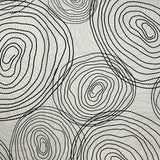 Popeline de coton imprimée escargot noir fond beige clair