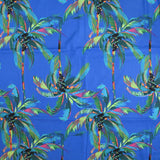 Popeline de coton imprimée palmier coloré fond bleu