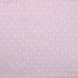 Piqué de coton imprimé cœur fond rose clair