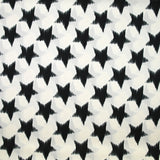 Satin polyester étoiles noires fond blanc cassé