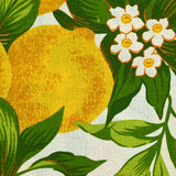 Polycotton printed lemons and green leaves white background