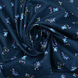 Popeline de coton imprimé Stitch fond bleu nuit
