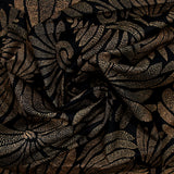 Popeline de coton imprimée pétales en pointillisme marron fond noir