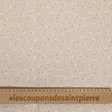 Pique of cotton printed dandelion beige background