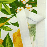 Polycotton printed lemons and green leaves white background