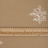 Crêpe viscose embroidered aurore beige background