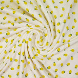 Jersey pointelle coton imprimé citron fond blanc cassé