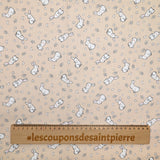 Piqué de coton imprimé jeune lapin fond beige