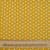 Cotton poplin printed stars mustard background