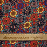 Coton imprimé kaléidoscope floral jaune et rouge