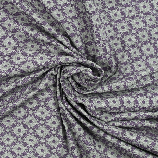 Jersey de coton imprimé rosaces violettes fond gris chiné