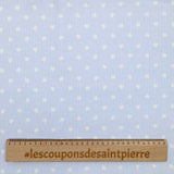 Cotton printed cotton stuck in light blue background