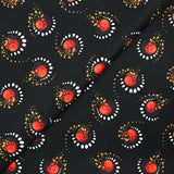 Gabardine de laine mélangée imprimée éclipse orange fond noir