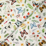 Coton imprimé papillons multicolore fond blanc
