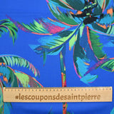 Popeline de coton imprimée palmier coloré fond bleu