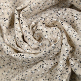 Voile de coton imprimé et floqué fleurettes fond beige clair