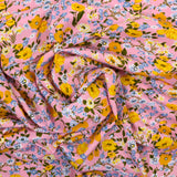 Viscose imprimée fleurs moutarde fond rose