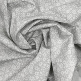 Piqué de coton imprimé fleurs printanière fond gris