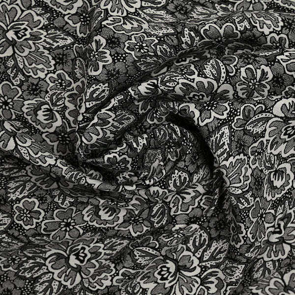 Jacquard de polyester élasthanne fleurs Iris noir et blanc
