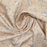 Piqué de coton imprimé jeune lapin fond beige