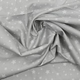 Piqué de coton imprimé étoiles fond gris