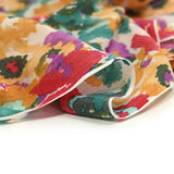 Turquoise, red and orange polycoton sail printed.