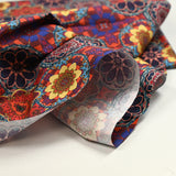 Coton imprimé kaléidoscope floral jaune et rouge