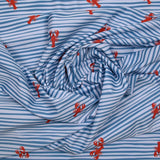 Recycled swimsuit fabric upf50 striped and lobster blue and white background
