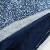 Chambray matelassé imprimé tie and dye petites fleurs