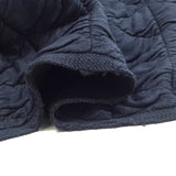 Matelassé jersey triangle navy blue background