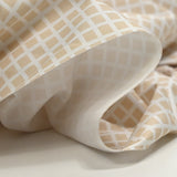 Piqué de coton imprimé carré beige