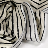 Coton imprimé fin taches rayées noir fond écru