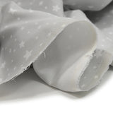 Piqué de coton imprimé étoiles fond gris