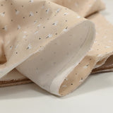 Pique of cotton printed dandelion beige background