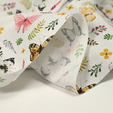 Coton imprimé papillons multicolore fond blanc