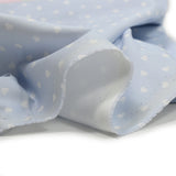 Cotton printed cotton stuck in light blue background