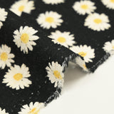Jacquard de coton natté marguerite fond noir