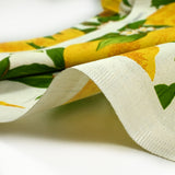 Polycotton printed lemons and green leaves white background