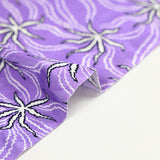 Jersey de viscose satiné imprimé étoile blanche fond mauve