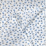 Voile de coton imprimé plumetis petites fleurs beige et bleu