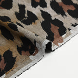 Maille Milano polyviscose leopard fond taupe