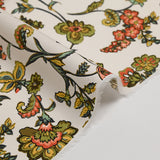 Cotton poplin digitally printed with coral and olive Indian flowers on an ecru background