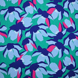 Satin de coton élasthanne fleurs bleu fond vert menthe