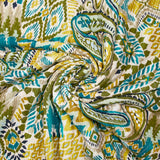 Double gaze matelassée double face ikat et cachemire vert et ocre au mètre