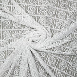 Dentelle polyester géométrie de fleurs fond blanc