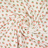 Jersey pointelle coton imprimé cerise fond blanc cassé