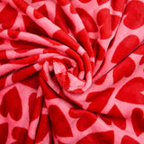 Polaire doudou imprimée coeur rouge fond rose