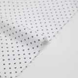 Coton imprimé signe géométrique bleu marine fond blanc cassé