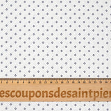 Coton imprimé signe géométrique bleu marine fond blanc cassé
